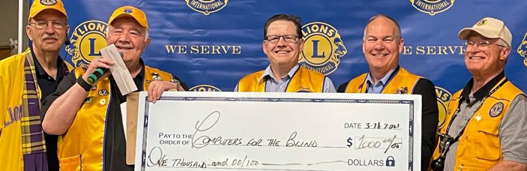 Lions Club donating a check