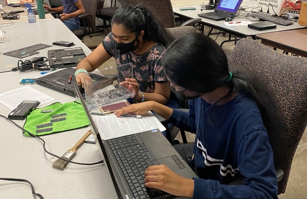 Computers being worked on by volunteers
